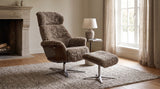 KAWOLA Sessel TOSAR Relaxsessel drehbar Schaffell grau mit Hocker