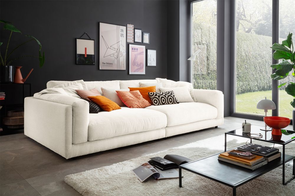 KAWOLA Sofá extra ancho RAINA Cord crema blanco