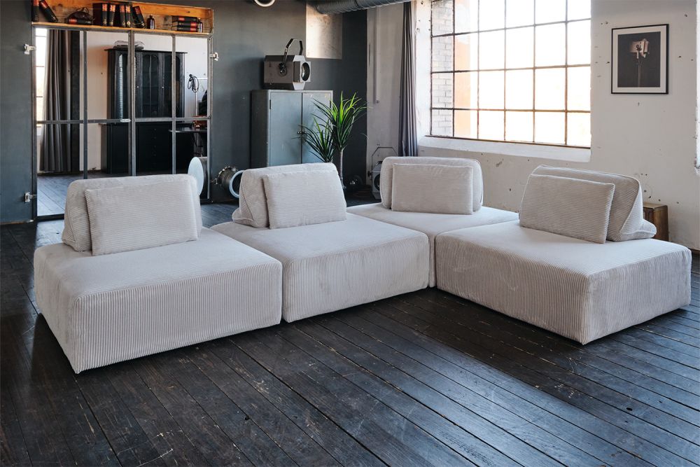 KAWOLA sofá modular WIOLO SOFT 4 módulos 4 cojines de respaldo pana gris claro